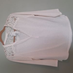 NWT H&M cream blouse with lace cutouts sz Med slight high low hem.